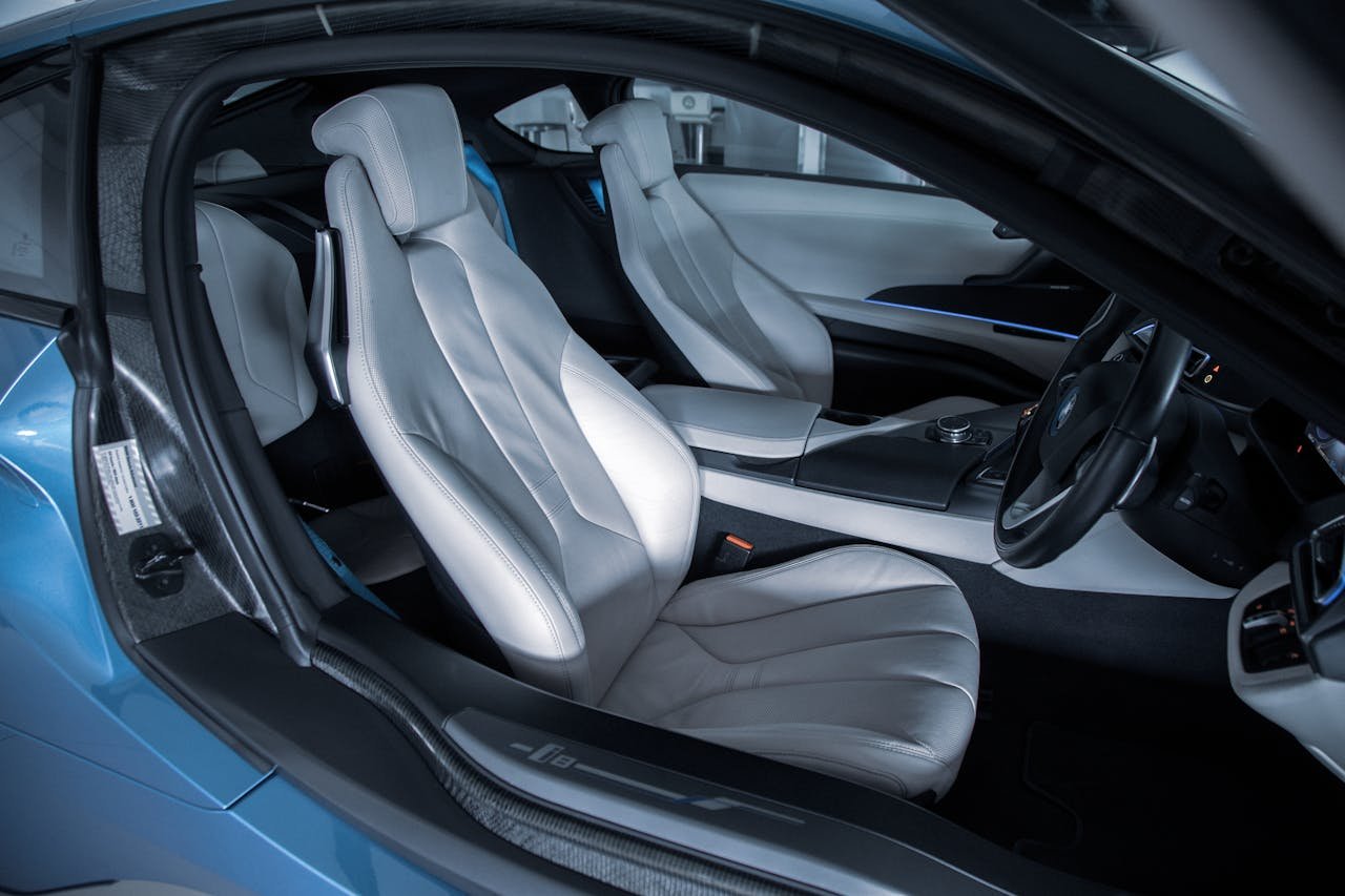 Explore the sleek and luxurious interior of a modern sports car featuring premium leather seats and sophisticated design.